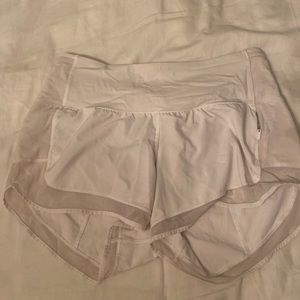 Lululemon white work out shorts with sheer lining and side zipper